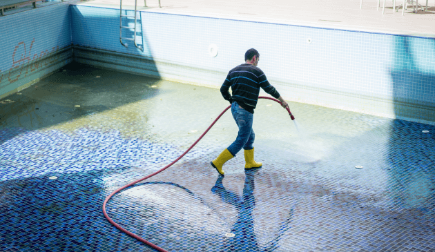 Swimming pool drain and clean service to remove debris, algae, and restore water clarity