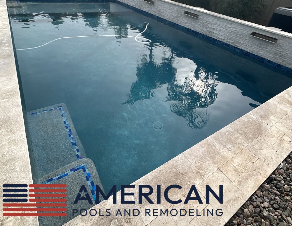 Clear modern pool maintained with weekly pool service in Arizona showing proper circulation and clean water