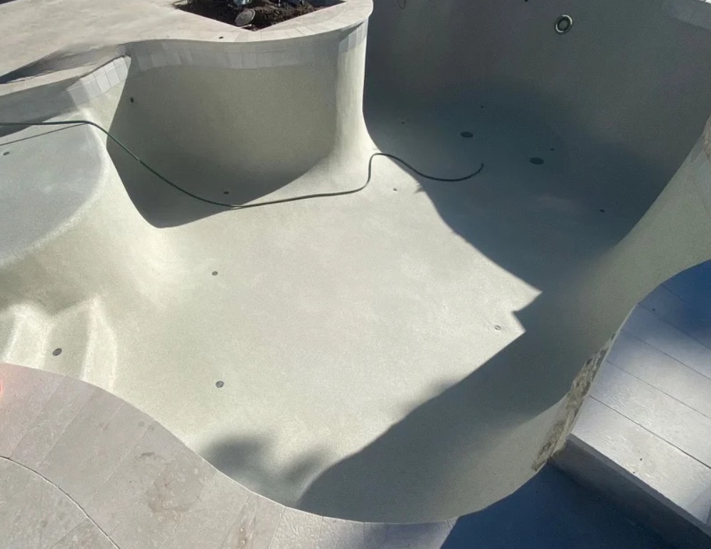 Alt text: New pool interior finish during an Arizona pool resurfacing project