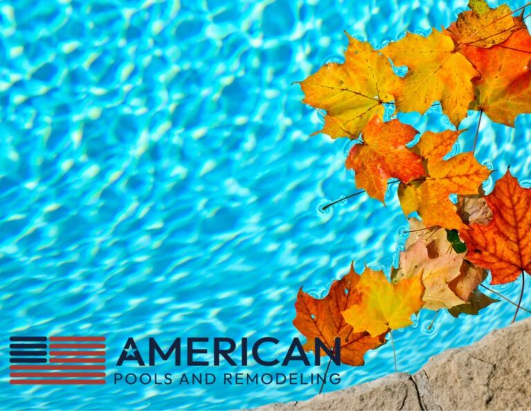 Colorful fallen leaves floating in swimming pool water, illustrating fall pool care and landscaping debris in Arizona.